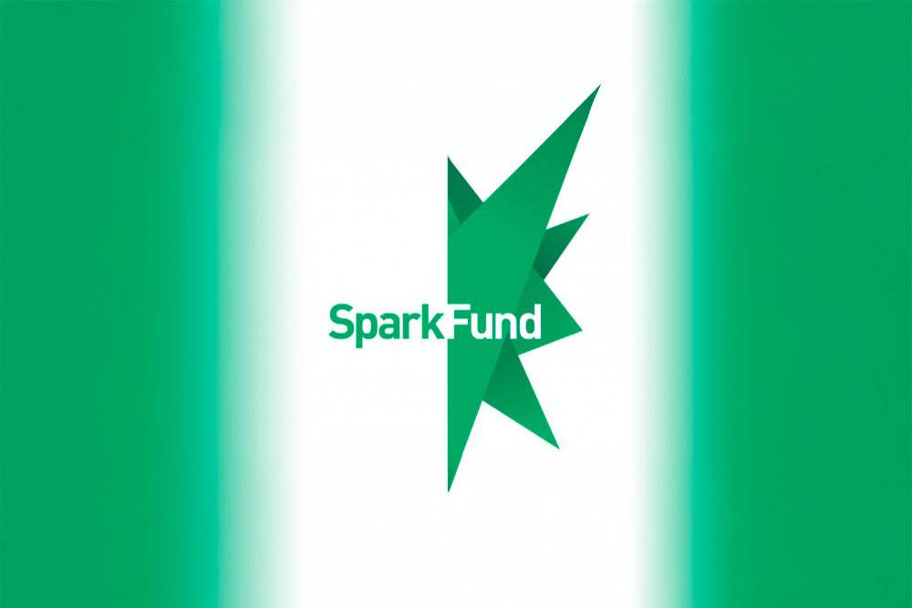 Green and white logo featuring an abstract star shape with sharp angles. The word 'SparkFund' is in bold green text across the star, conveying energy and innovation.