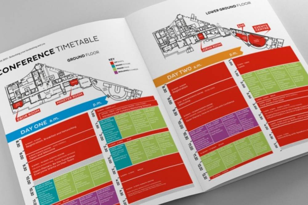 Open booklet showing a conference timetable with maps of the ground and lower ground floors. Colour-coded sections for days one and two include detailed schedules.