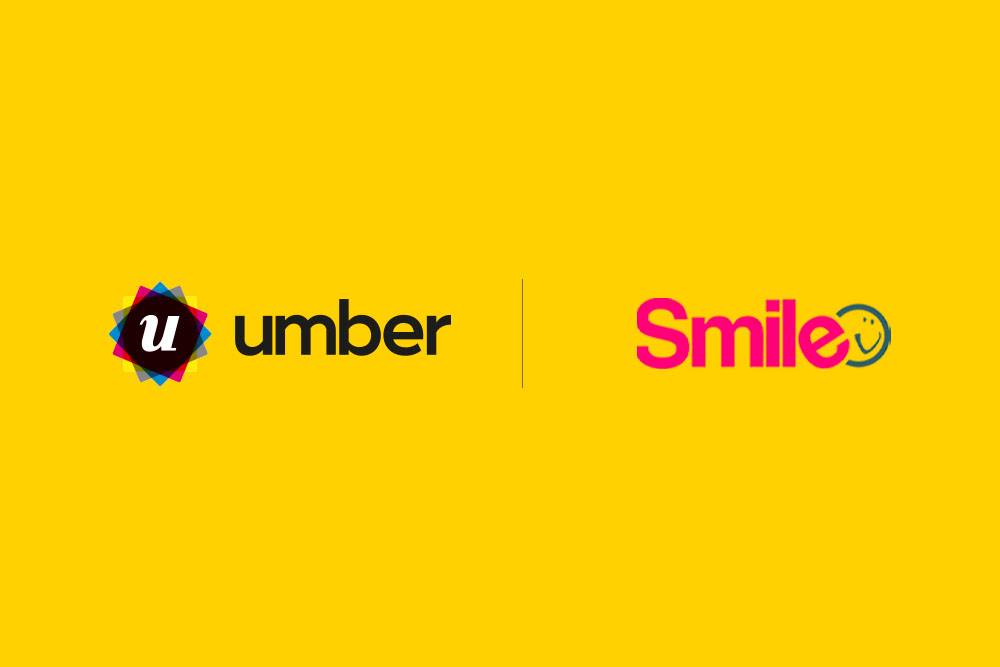 Logos for 'umber' and 'Smile' on a yellow background. 'Umber' is in bold black, with a colourful 'u' icon. 'Smile' is pink with a smiling face in the 'e'.